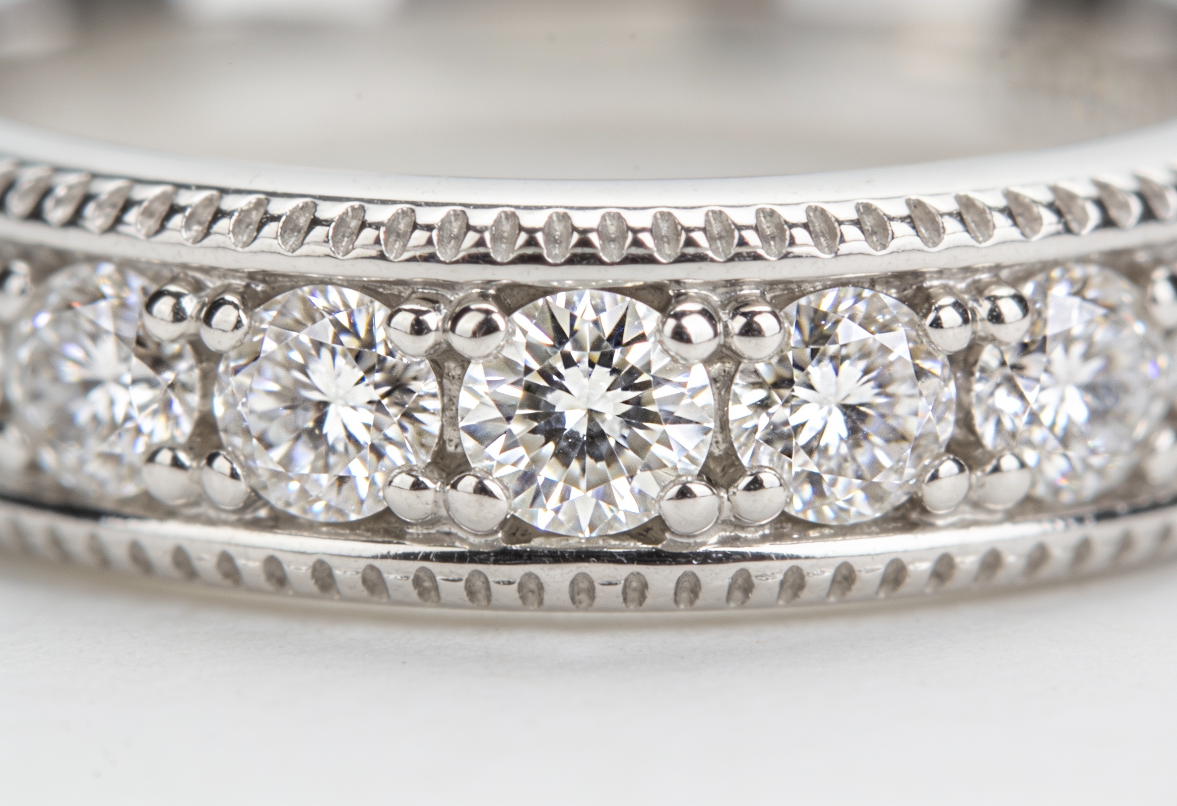 Wedding Bands in Canada: Styles, Metals & Custom Design 2 Diamond-set white gold wedding band macro