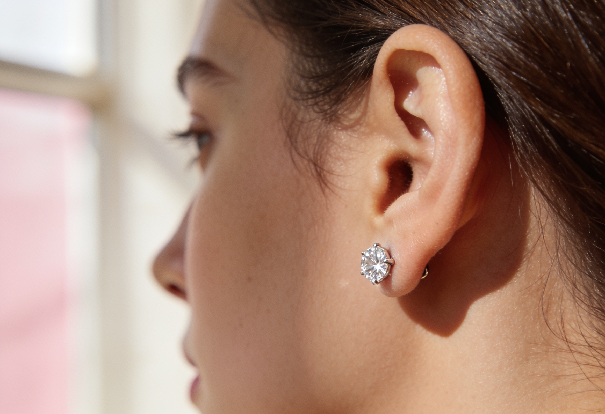Lab Grown Diamond Earrings in Canada 3 Lab grown diamond stud earring worn on an ear