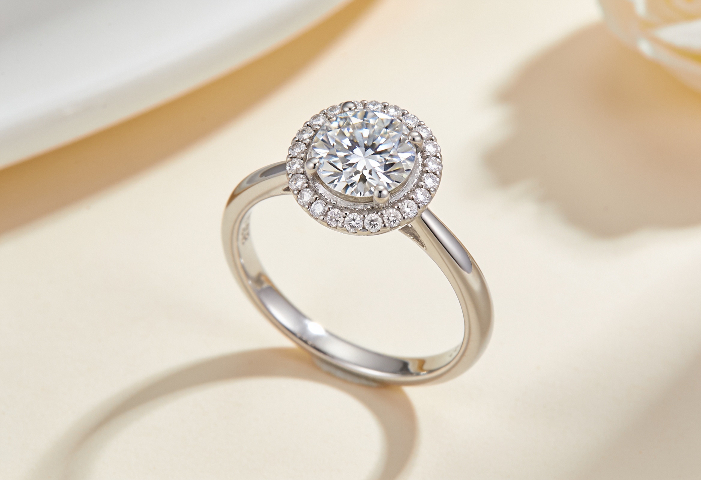 Halo lab grown diamond engagement ring with a round centre diamond in white gold