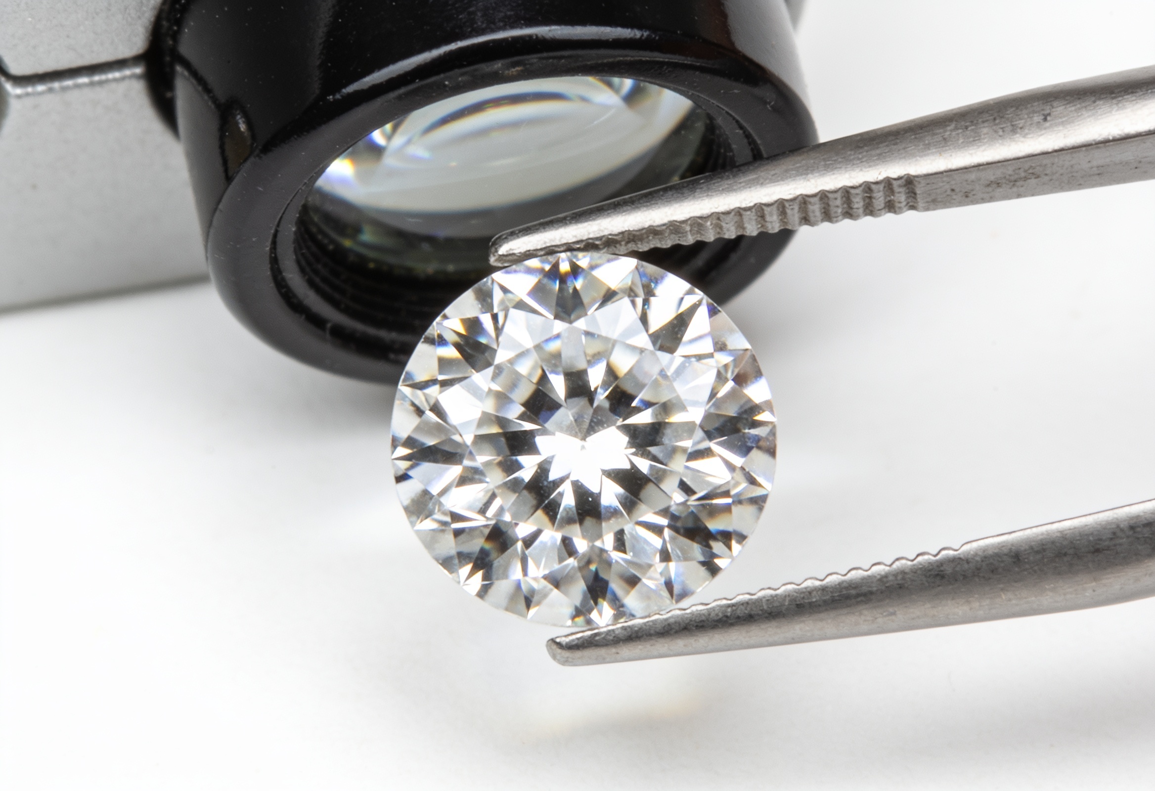 IGI vs GIA Diamond Certification 1 Round brilliant diamond examined with a jeweler's loupe during grading