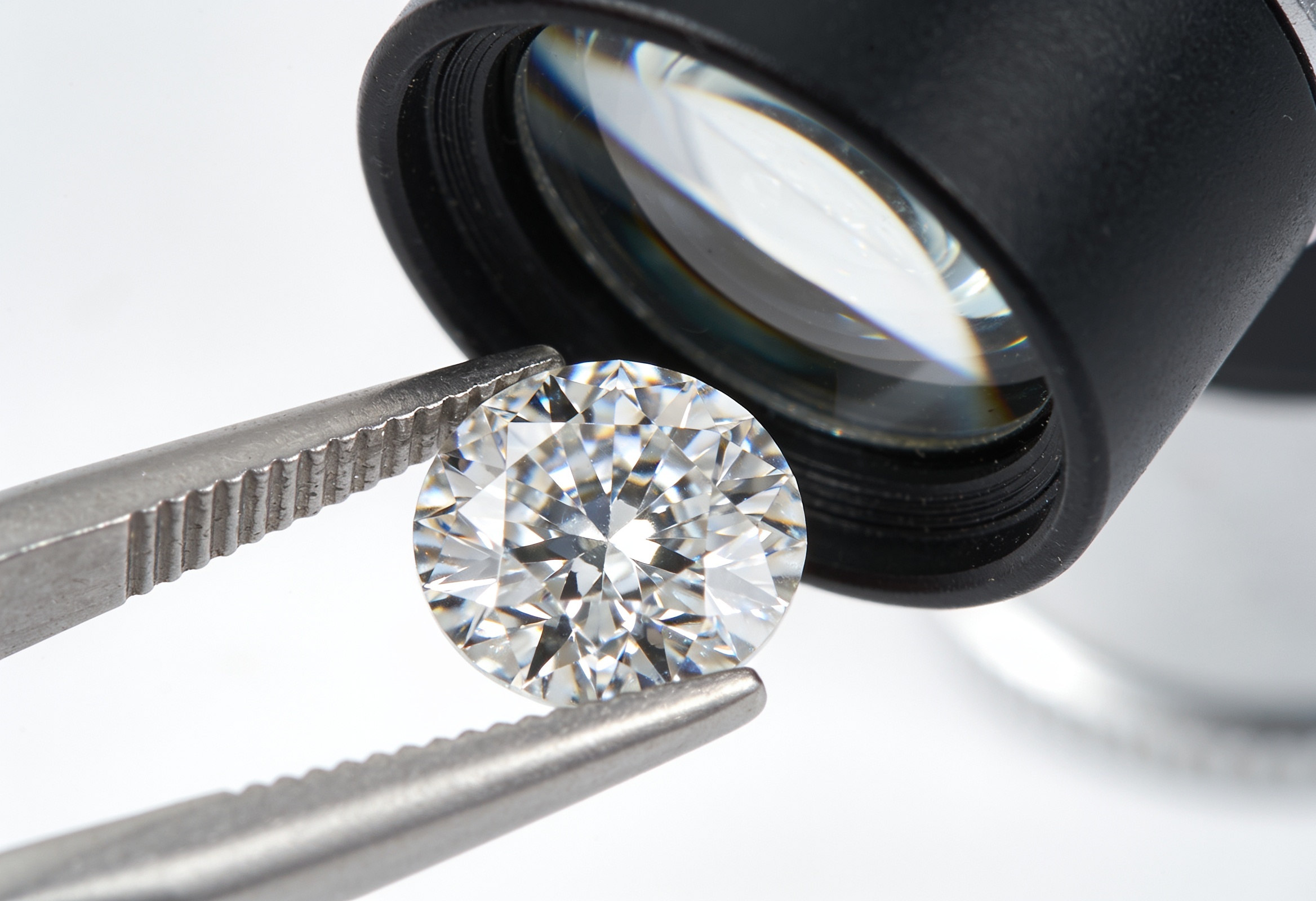Loose diamond examined under a jeweler's loupe