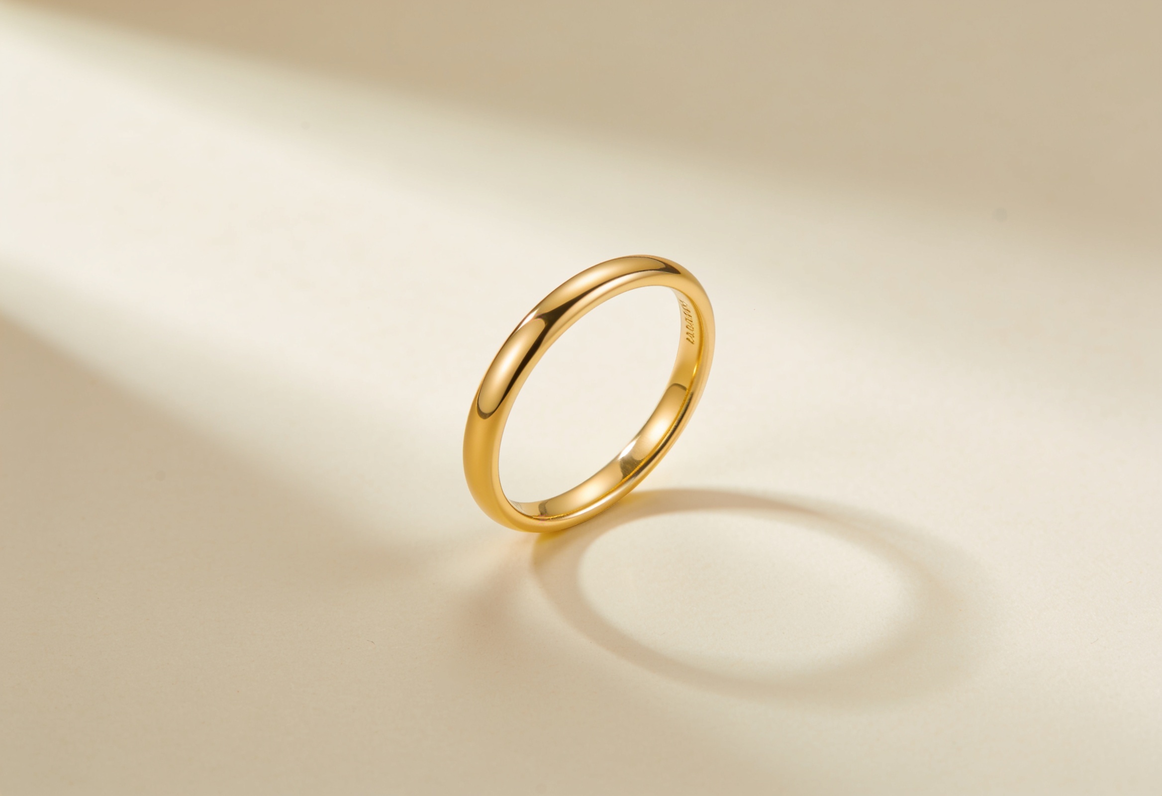 Women's plain delicate wedding band in yellow gold
